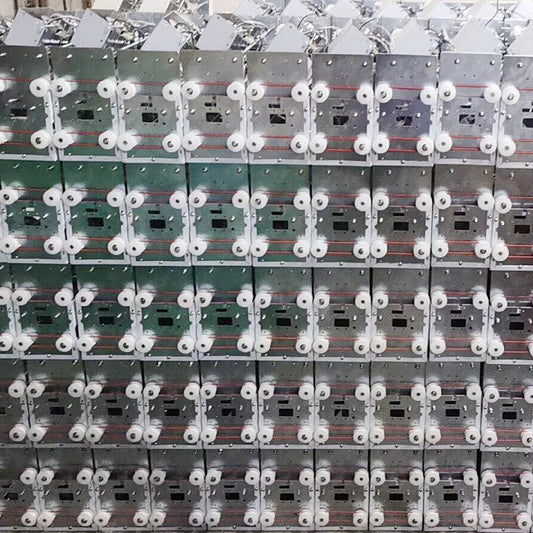 Claw machine gantry assemblies in production at Hiclawcrane factory — stainless steel and standard steel gantry units stacked for quality inspection before shipping