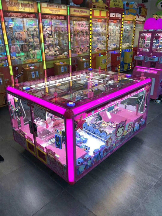 Multiple claw crane machines in an arcade venue filled with plush toys, showing a real claw machine business setup for operators
