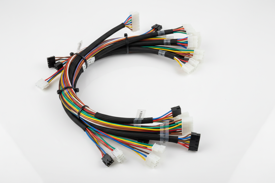 Claw machine wiring harness — color-coded wire bundle with labeled connectors for motors, mainboard, coin acceptor, and LED strips